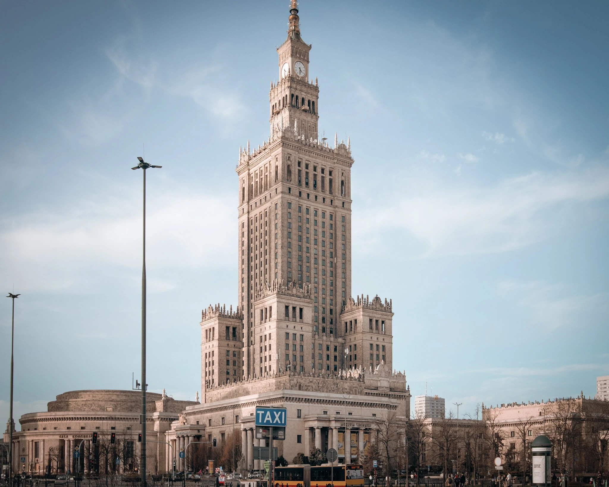 Warsaw's Palace of Culture and Science rising above a broad city square.